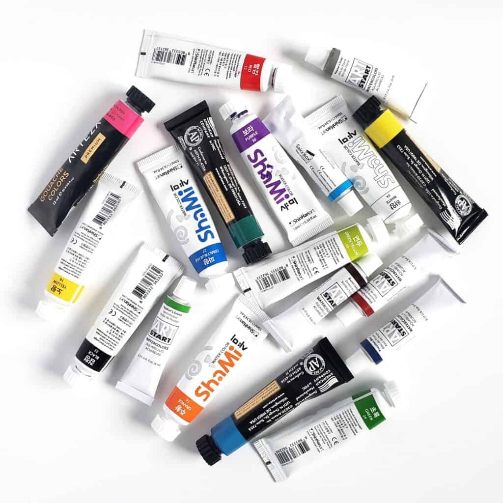 There is an image of an assortment of watercolor tubes. These paints are recommended for watercolor journaling because they're very pigmented and easy to use.